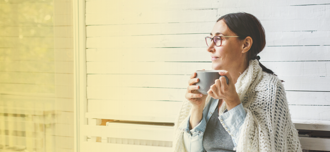 Woman drinking hot beverage